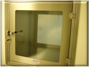 Intumescing transfer hatch with fire-rated glass vision panel