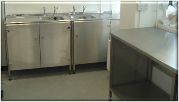 Stainless steel sink unit with storage cupboards