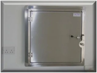 Wall-mounted intumescing and lead-lined stainless steel transfer hatch